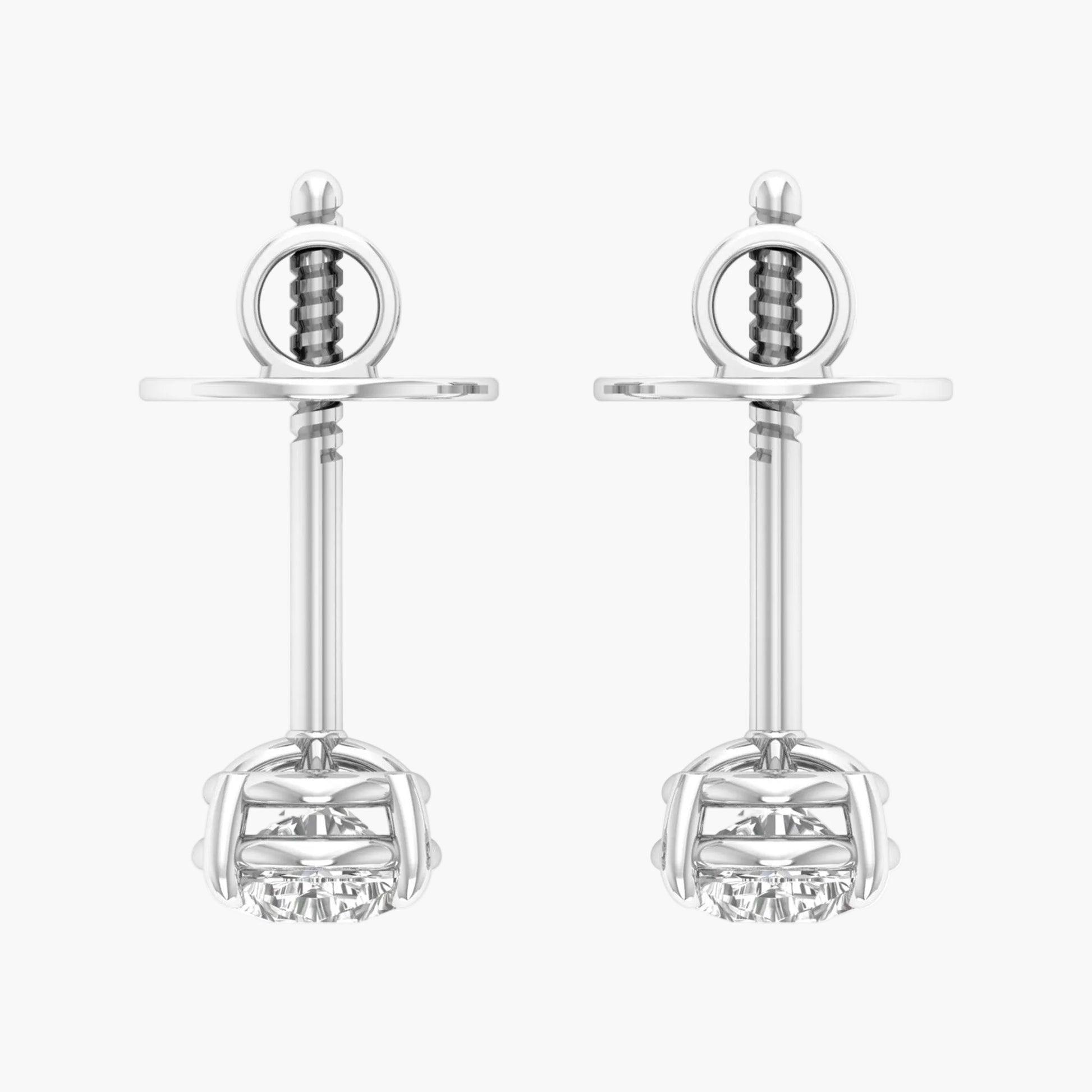Pair of silver earrings with clear gemstones on a white background