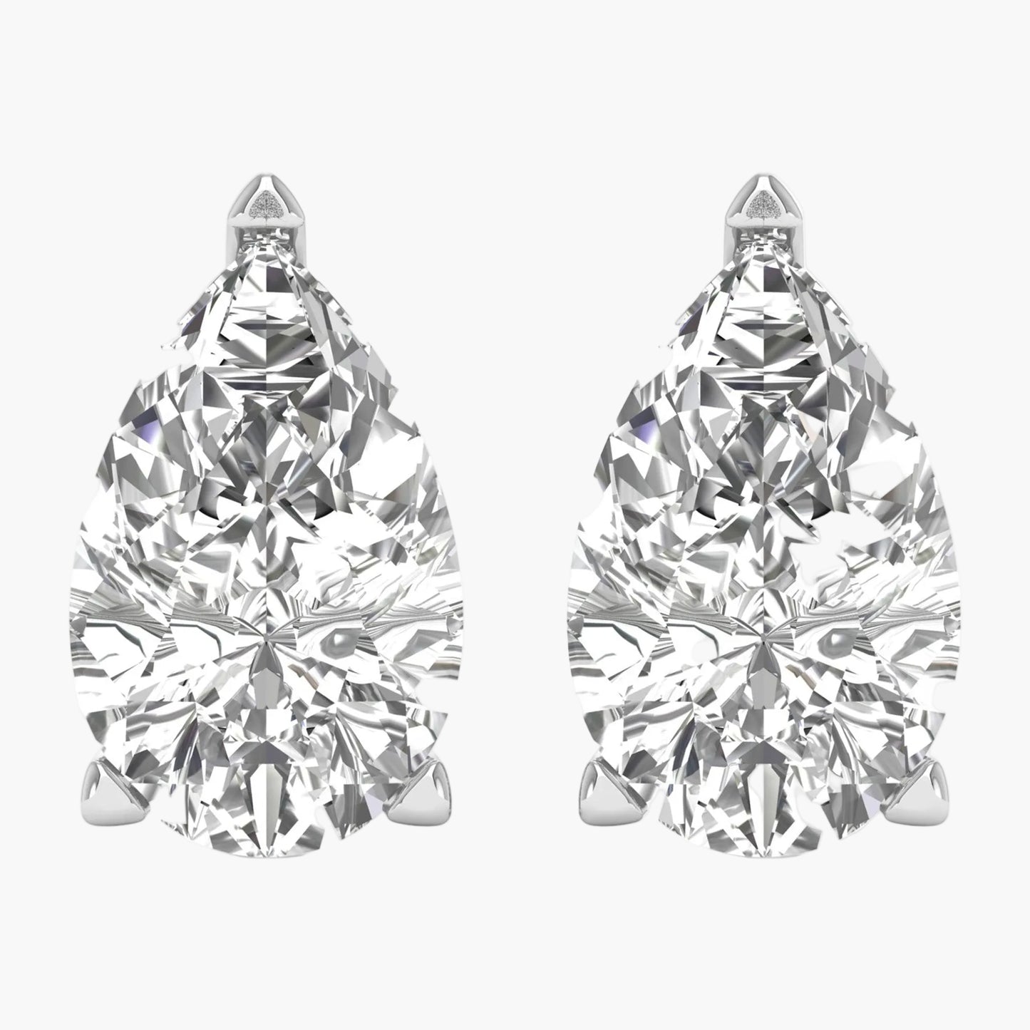 Pair of pear-shaped diamond earrings on a white background