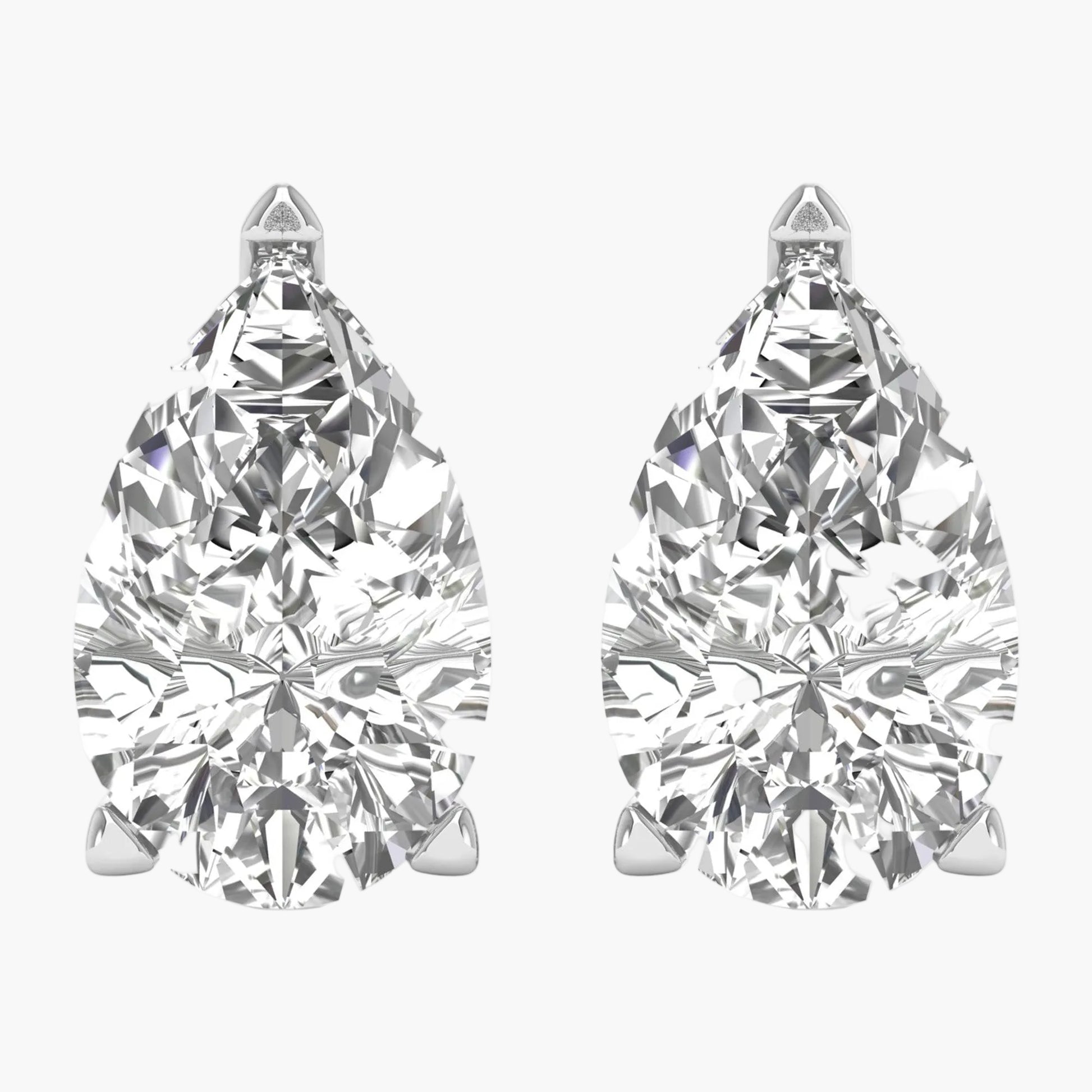 Pair of pear-shaped diamond earrings on a white background