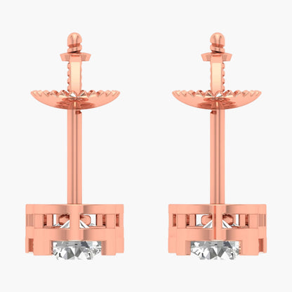 Rose gold earrings with clear gemstones on a white background