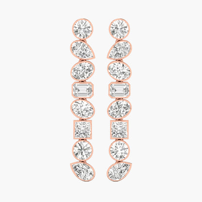 Rose gold earrings with clear gemstones on a white background