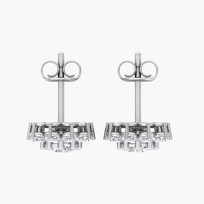 Pair of silver earrings with gemstones on a white background