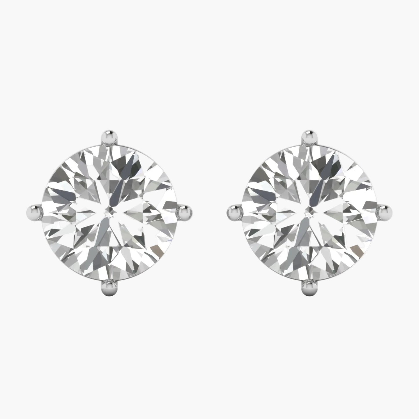 Pair of diamond stud earrings on a white background