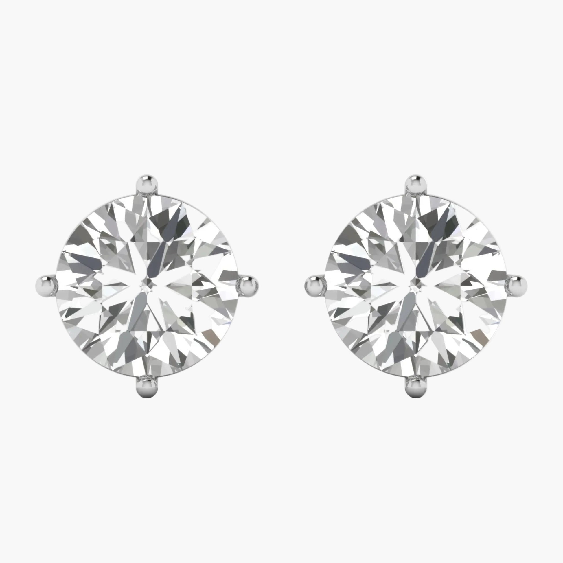 Pair of diamond stud earrings on a white background