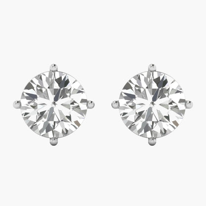 Pair of diamond stud earrings on a white background