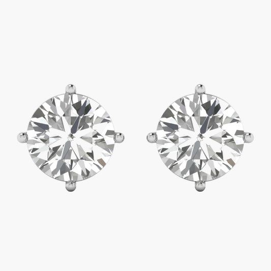 Pair of diamond stud earrings on a white background