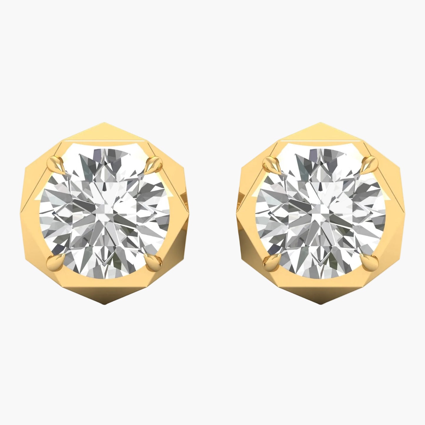 Gold earrings with round gemstones on a white background