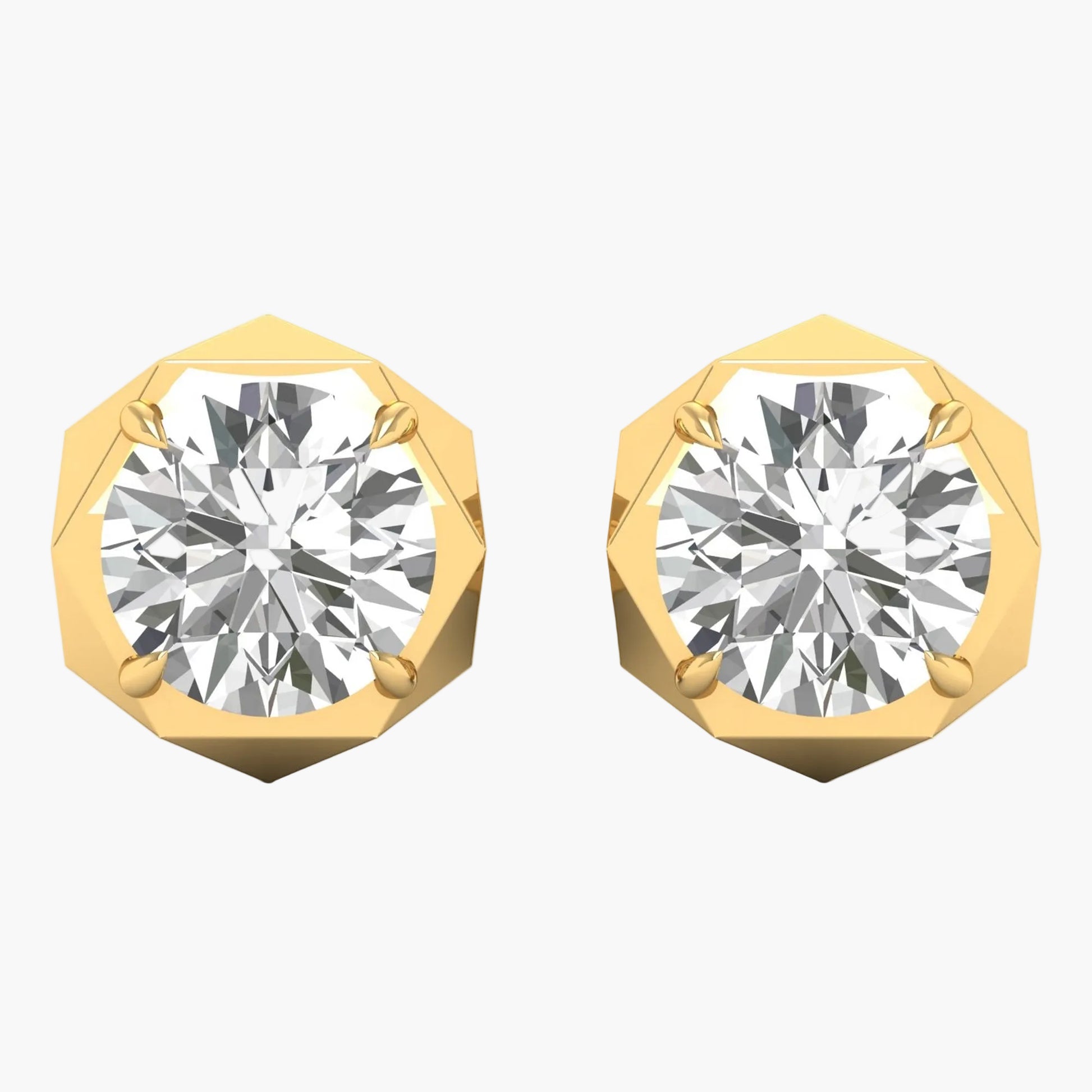 Gold earrings with round gemstones on a white background