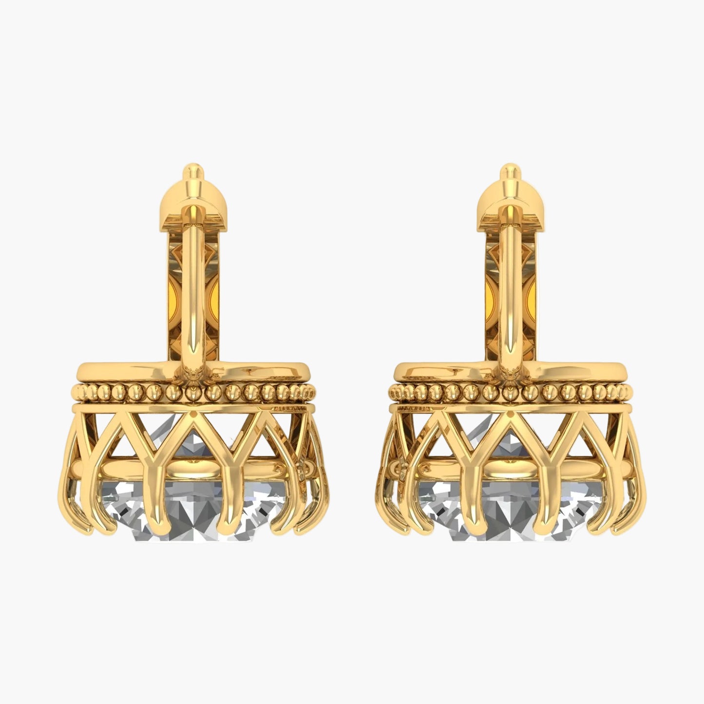 Gold earrings with crystal elements on a white background
