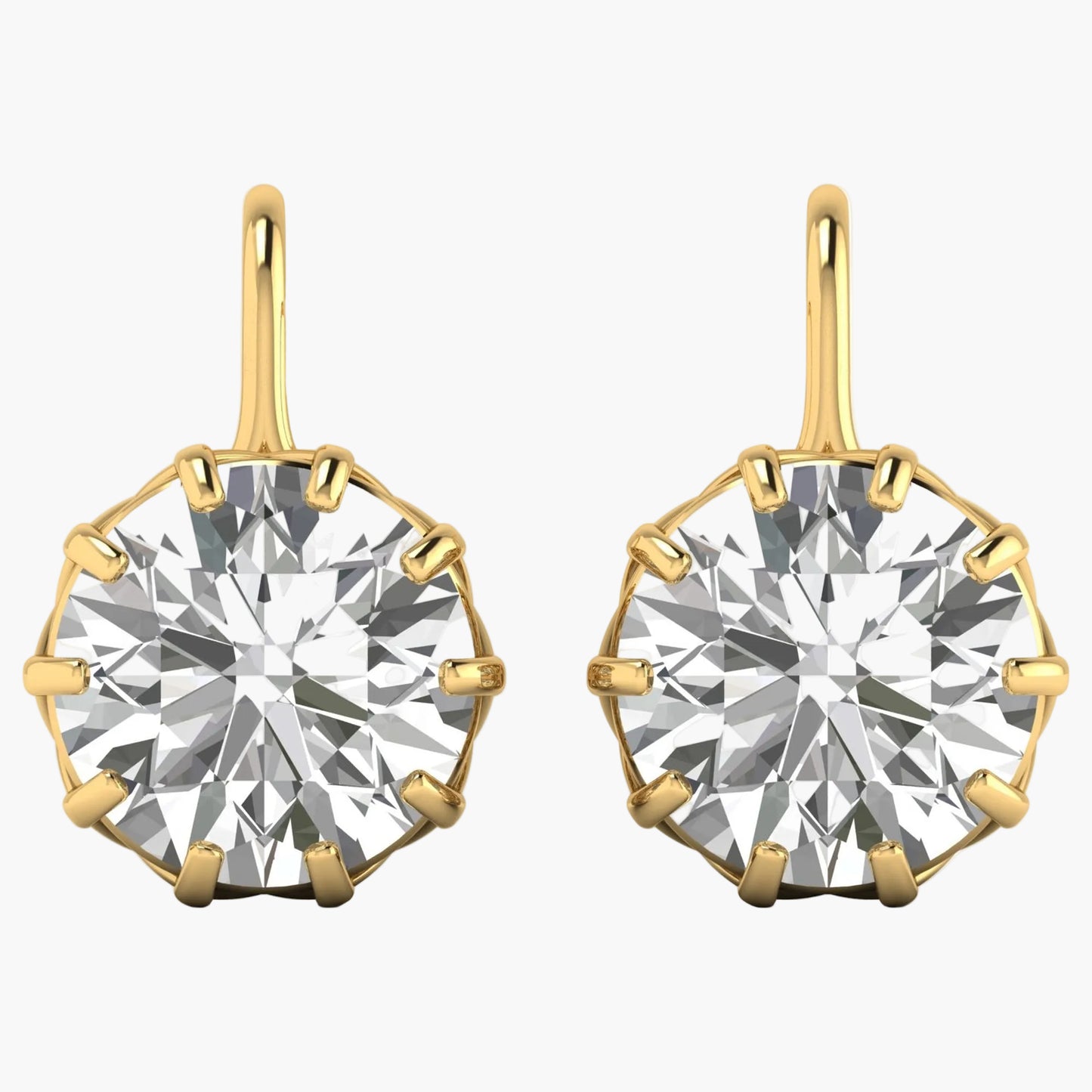 Gold earrings with large round gemstones on a white background