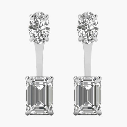 Pair of diamond earrings with round and emerald-cut stones on a white background