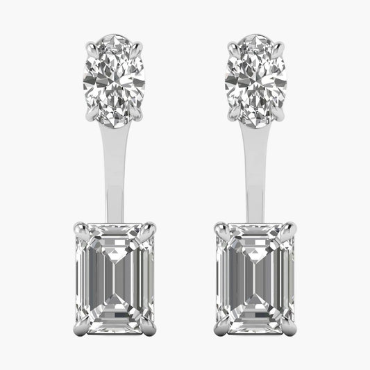 Pair of diamond earrings with round and emerald-cut stones on a white background