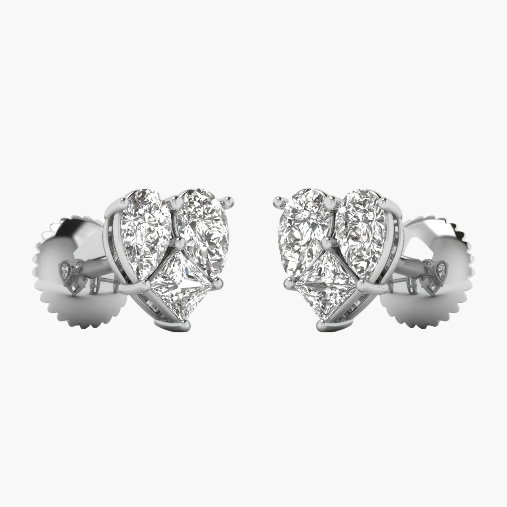 Heart-shaped diamond earrings on a white background