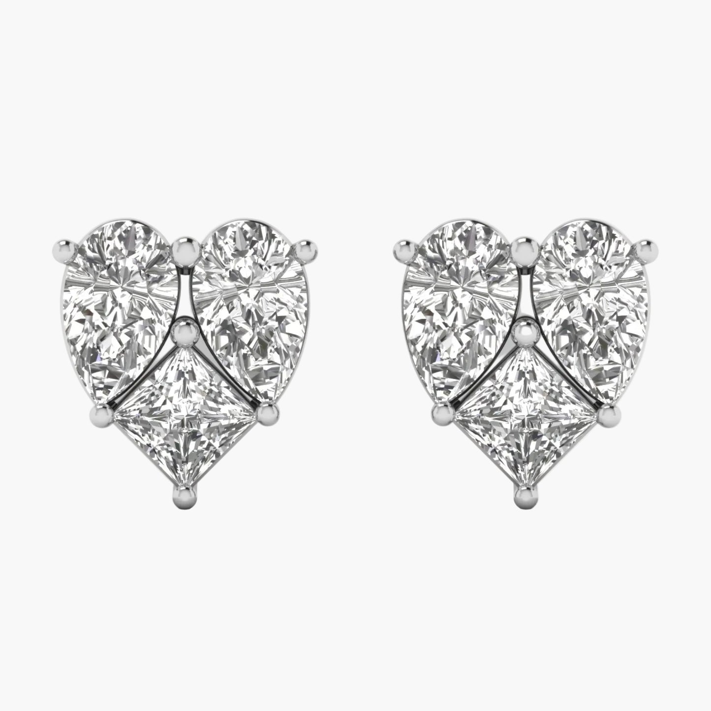 Heart-shaped diamond earrings on a white background