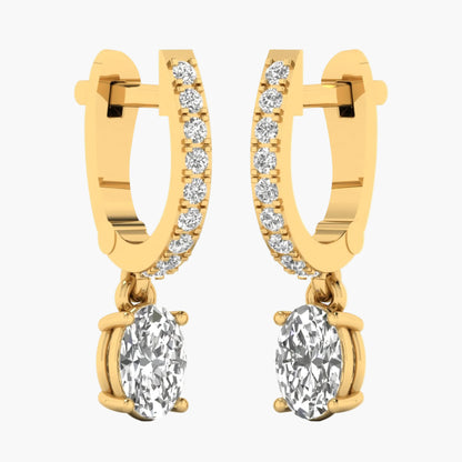 Gold hoop earrings with round gemstones on a white background