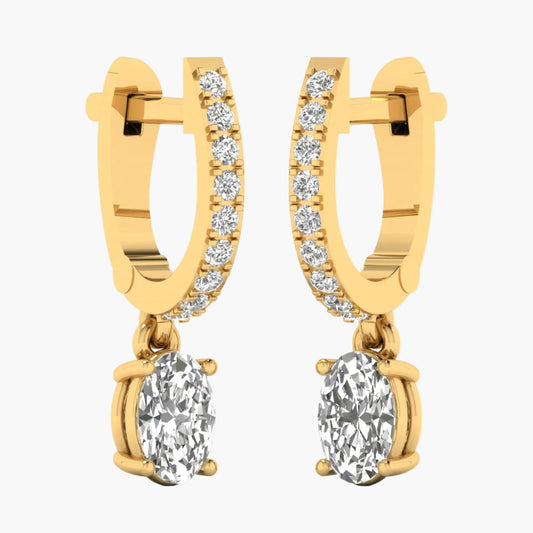 Gold hoop earrings with round gemstones on a white background