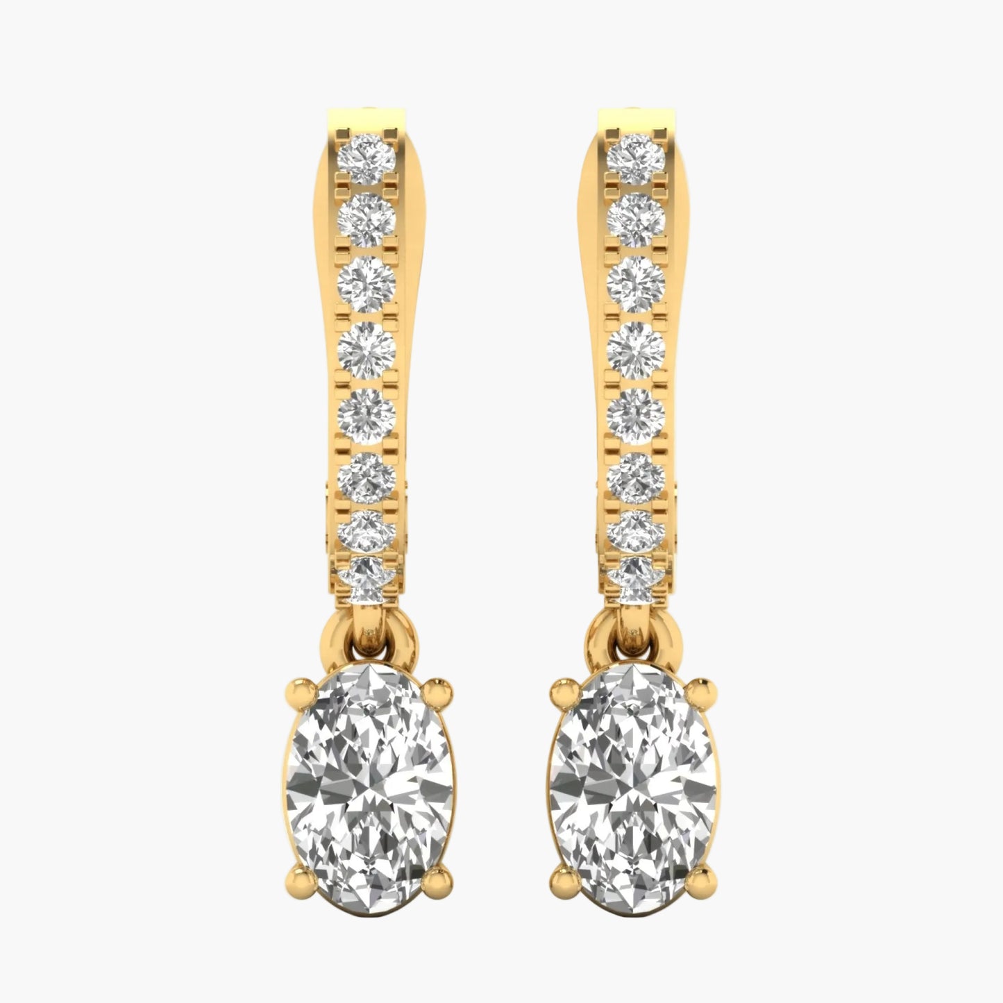 Gold earrings with clear gemstones on a white background