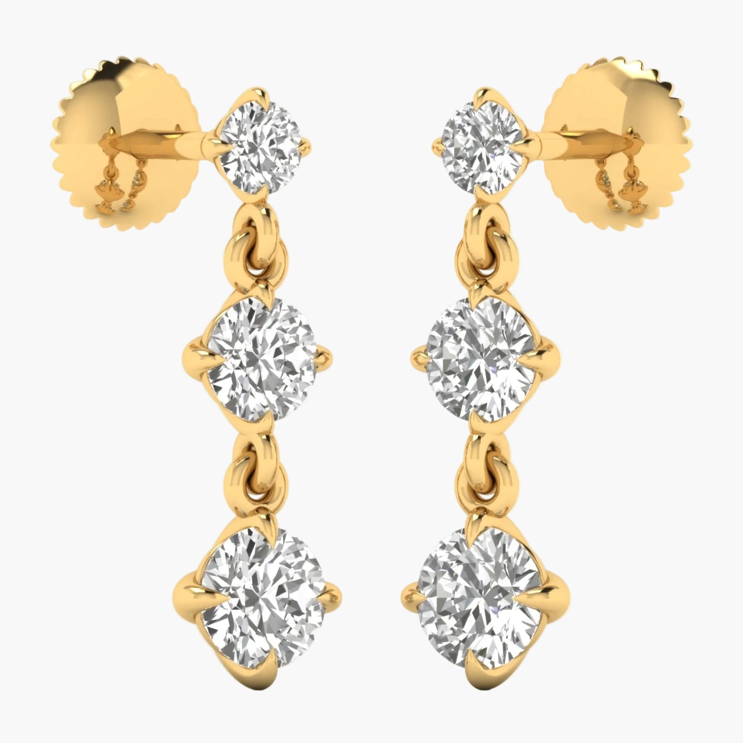 Gold earrings with clear gemstones on a white background