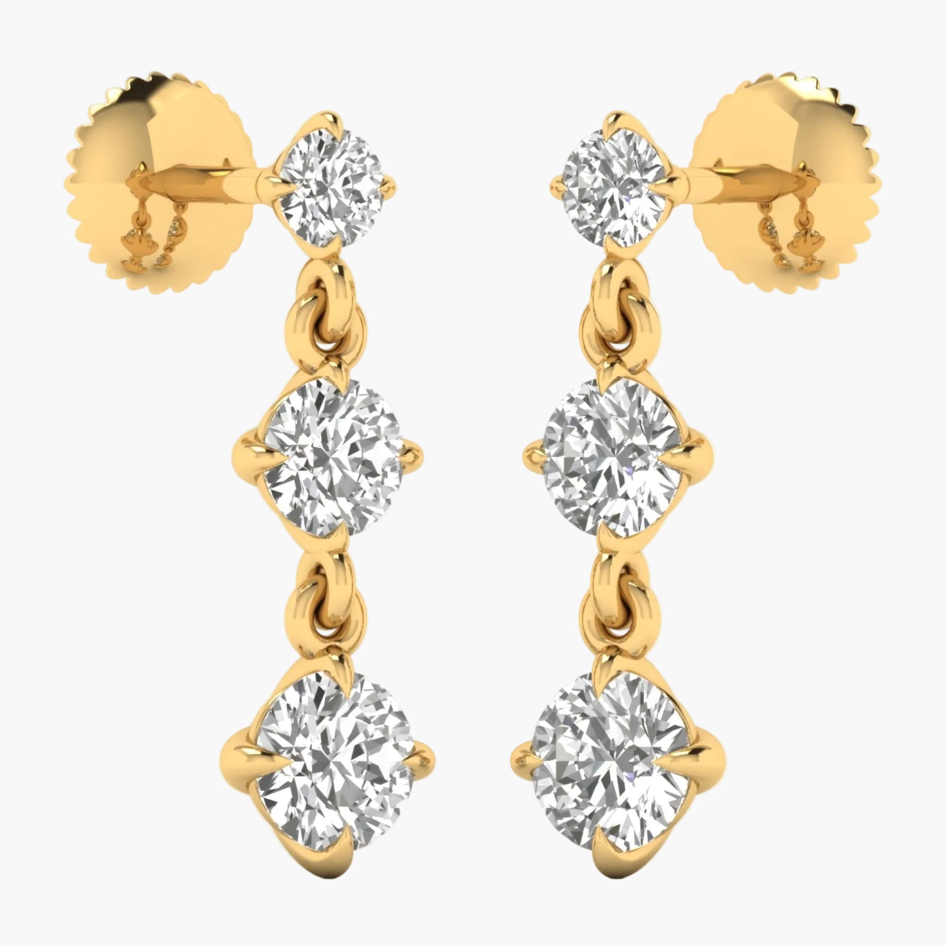 Gold earrings with clear gemstones on a white background