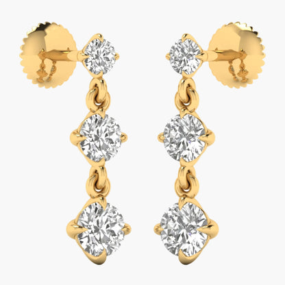 Gold earrings with clear gemstones on a white background
