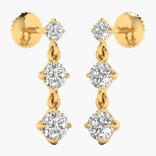 Gold earrings with clear gemstones on a white background