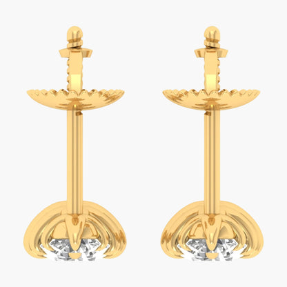 Pair of gold earrings with clear gemstones on a white background