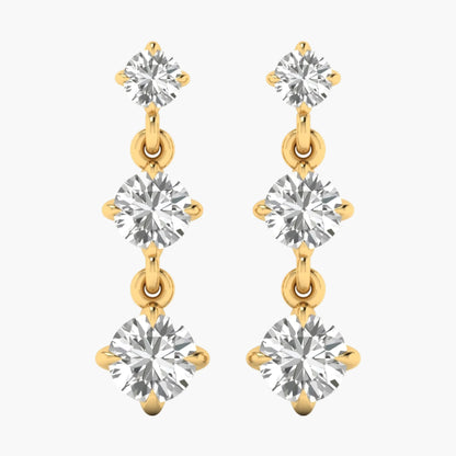 Gold and silver earrings with clear gemstones on a white background