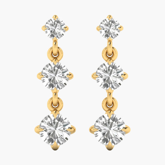 Gold and silver earrings with clear gemstones on a white background
