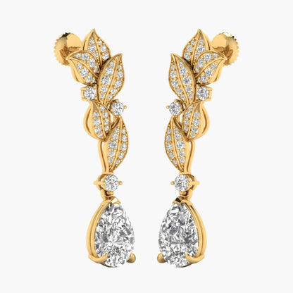 Gold earrings with leaf design and clear gemstones on a white background