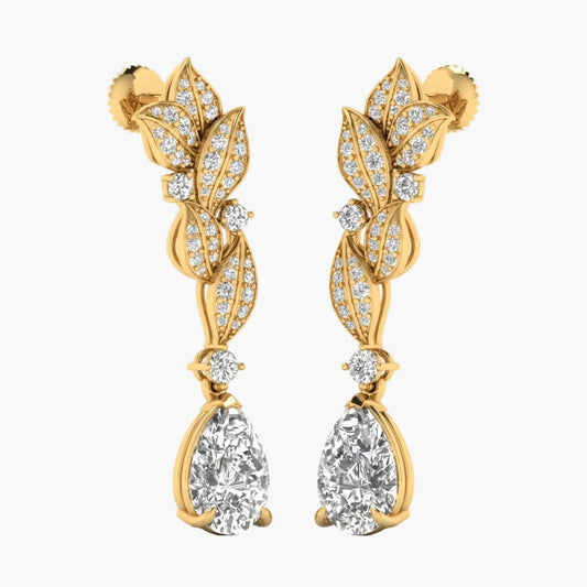 Gold earrings with leaf design and clear gemstones on a white background