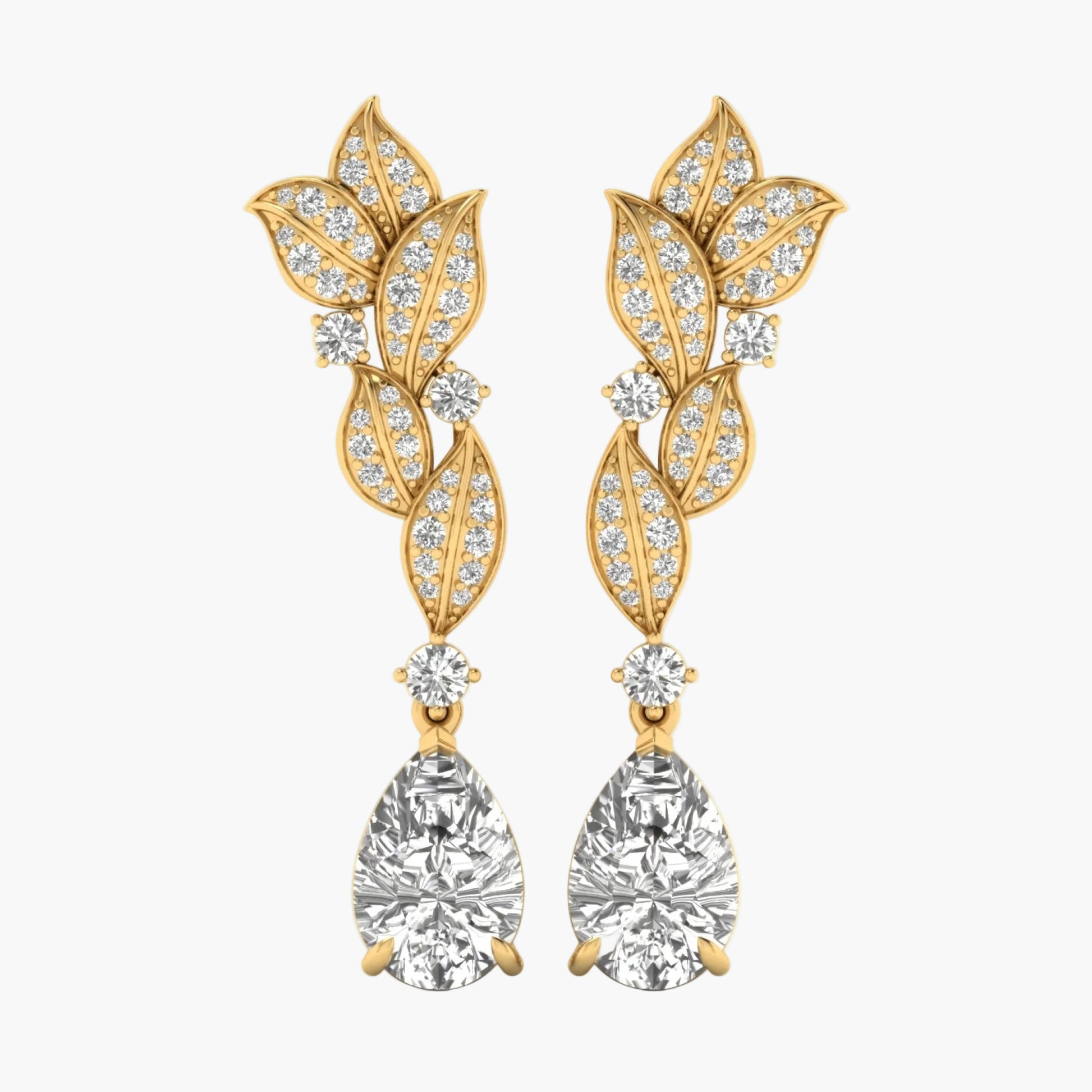 Gold leaf-shaped earrings with clear gemstones on a white background