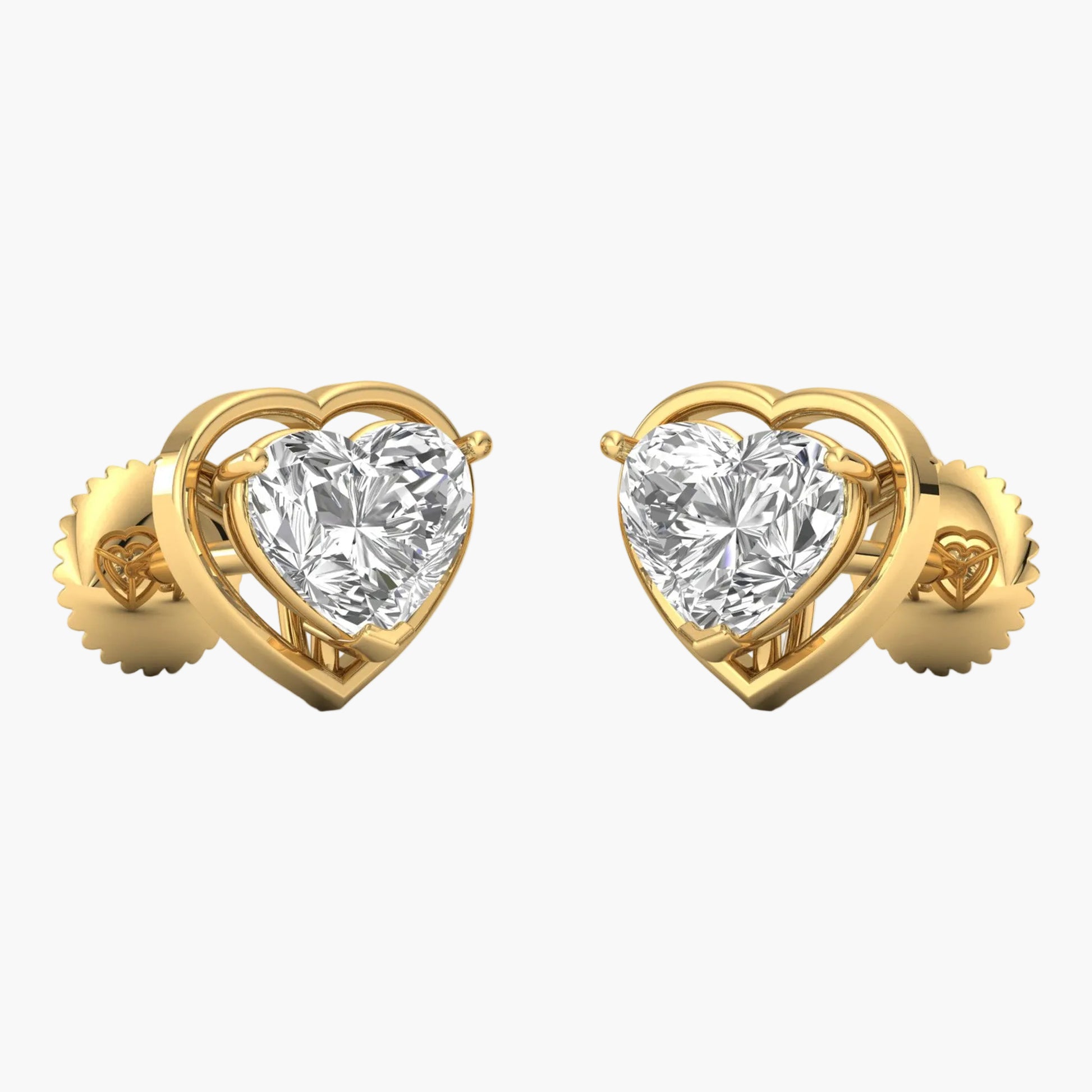Gold heart-shaped earrings with clear gemstones on a white background