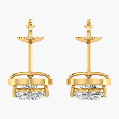 Gold earrings with clear gemstones on a white background