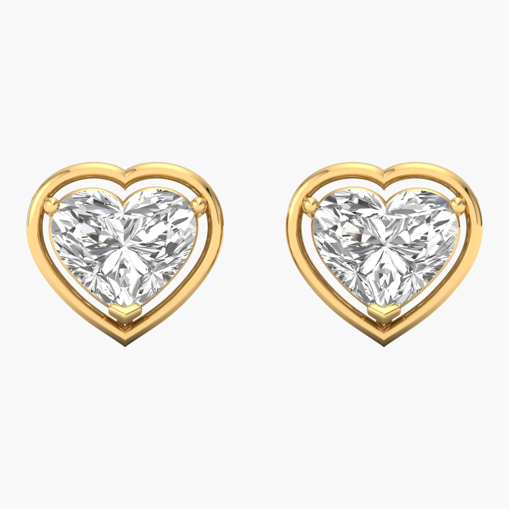 Heart-shaped diamond earrings with gold frames on a white background