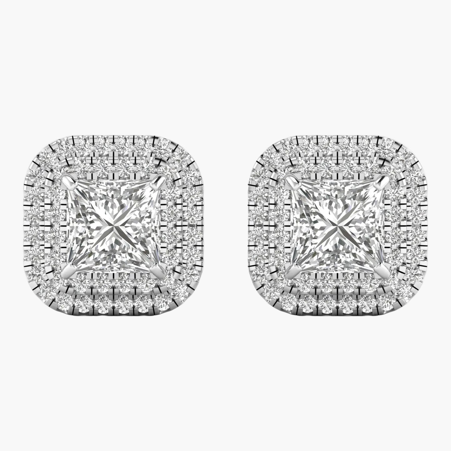 Pair of diamond earrings on a white background