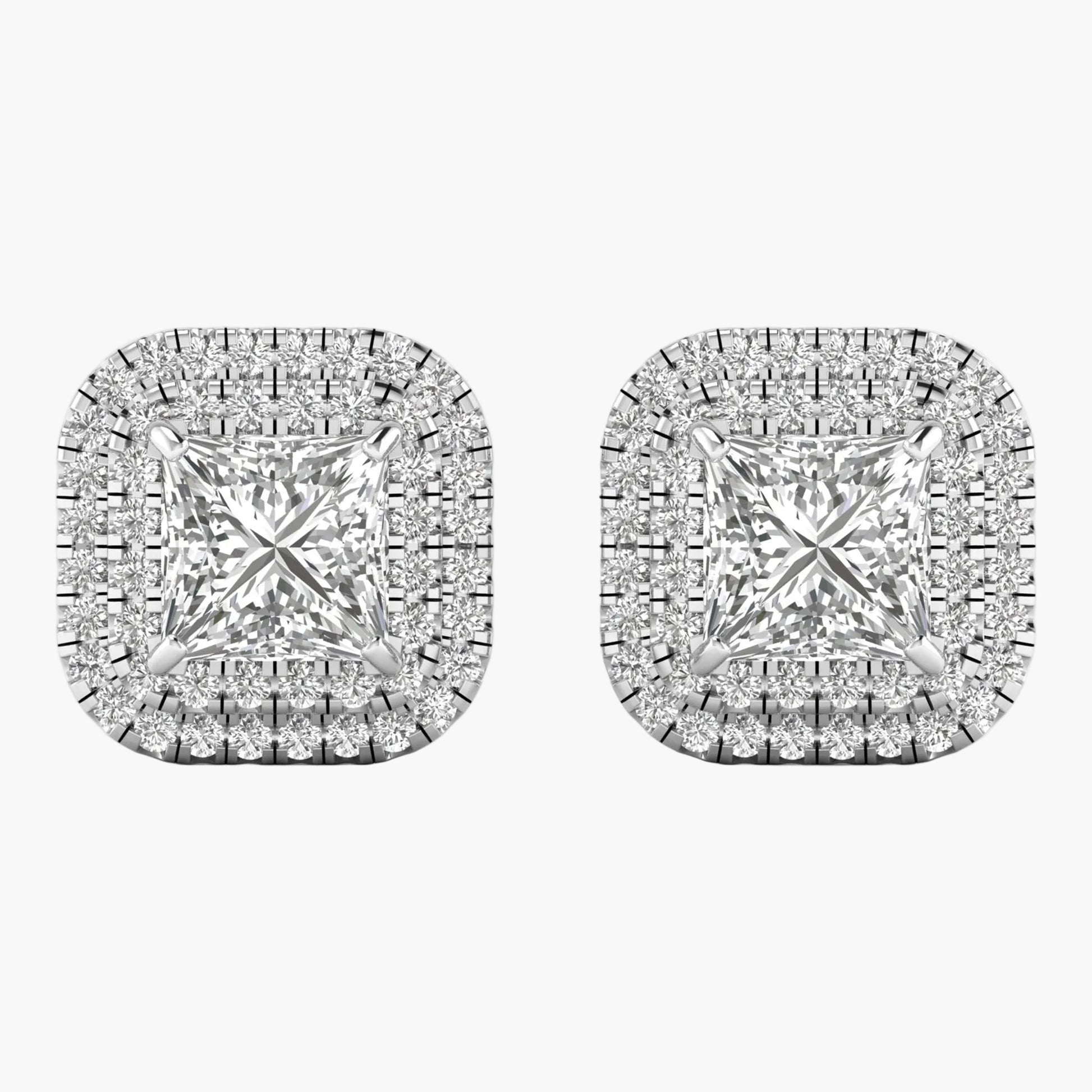 Pair of diamond earrings on a white background
