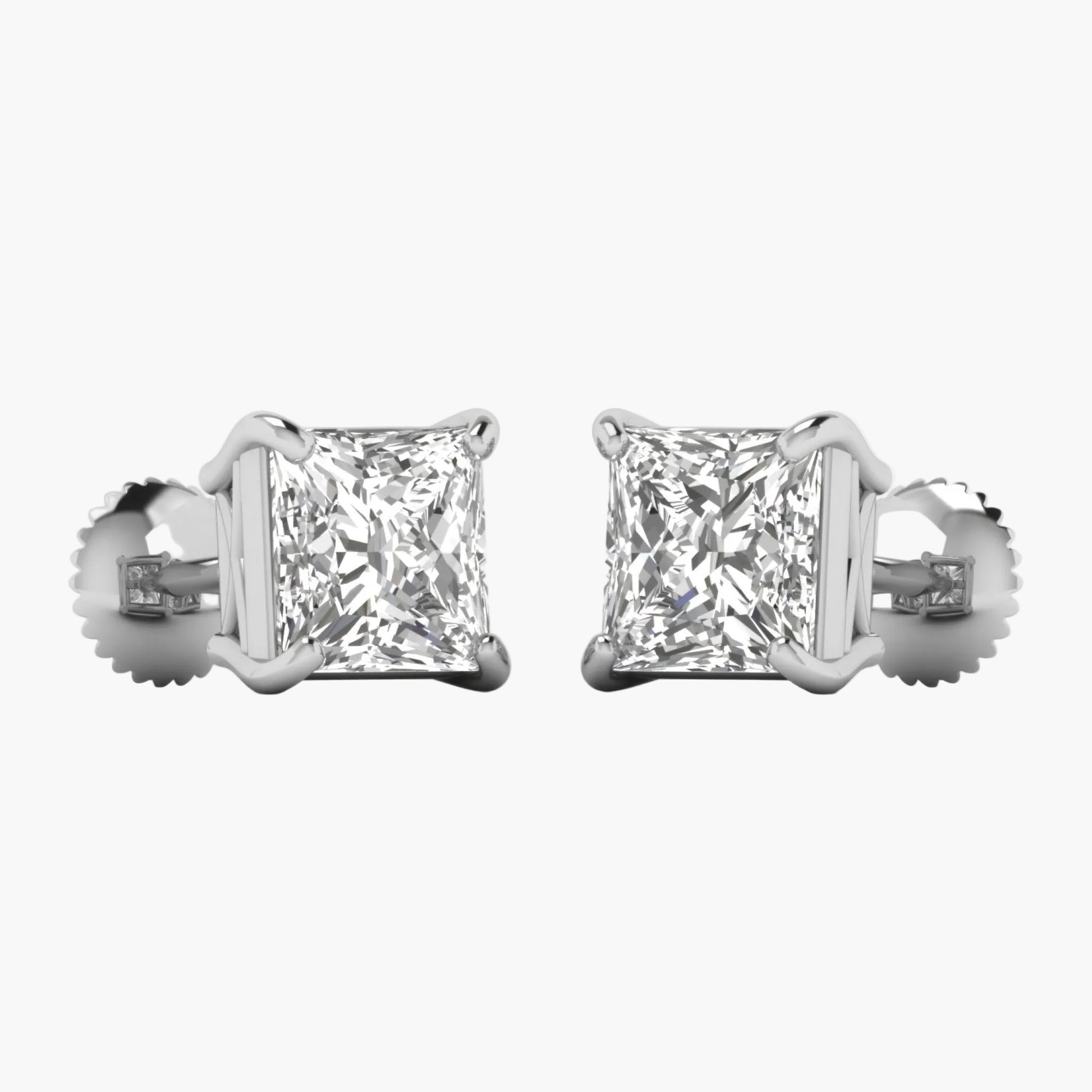 Pair of diamond stud earrings on a white background