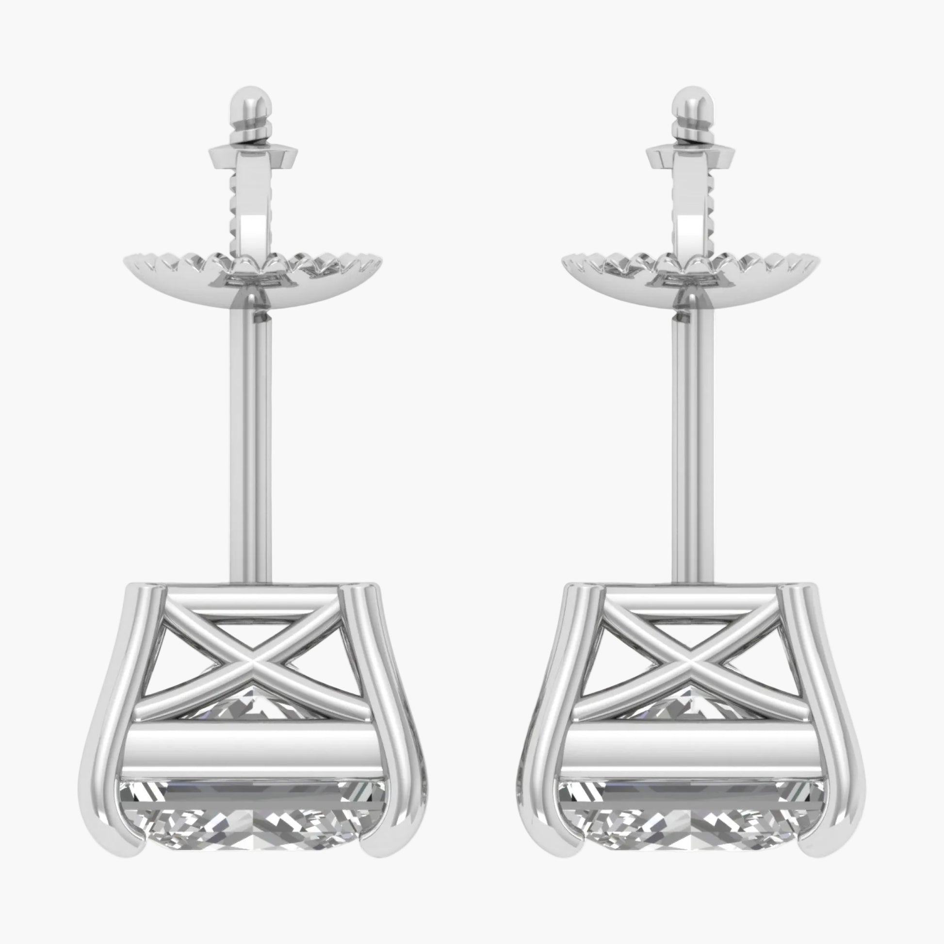 Pair of silver earrings with intricate designs on a white background