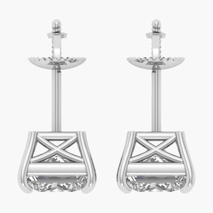 Pair of silver earrings with intricate designs on a white background
