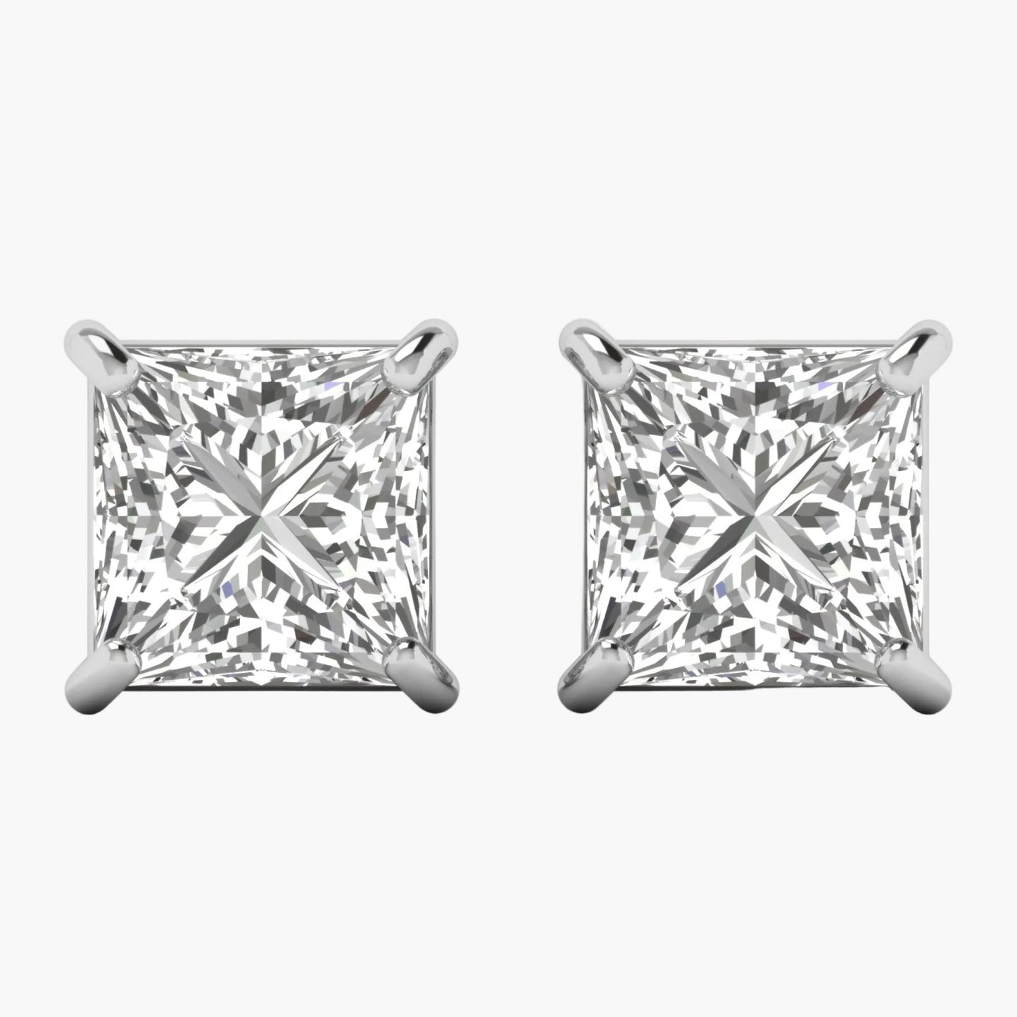 Pair of diamond stud earrings on a white background