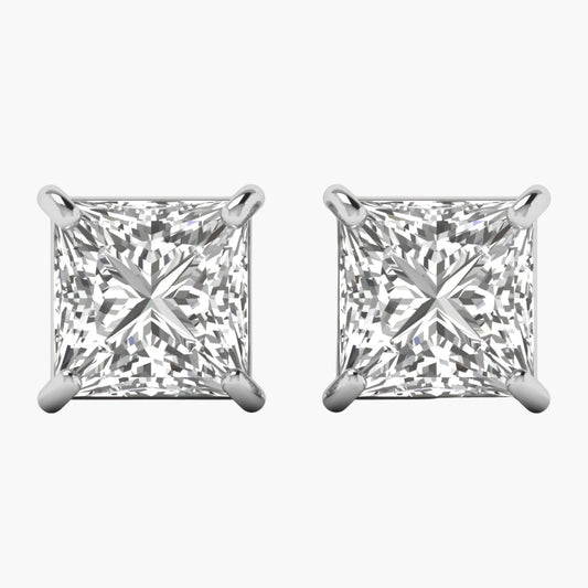 Pair of diamond stud earrings on a white background