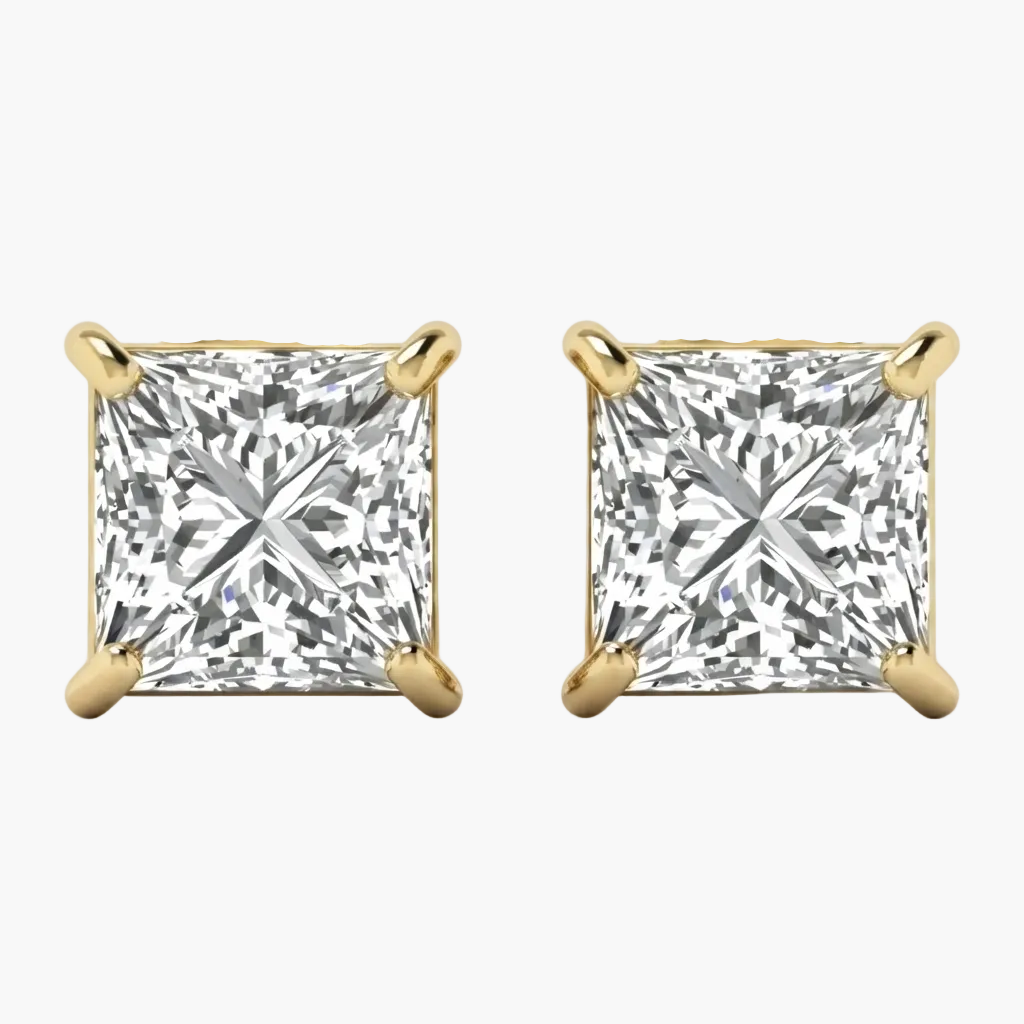 A pair of princess-cut diamond stud earrings in yellow gold four-prong settings, shown against a clean white background.