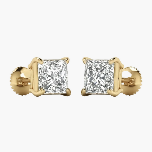 A pair of yellow gold stud earrings, each featuring a square princess-cut clear gemstone in a four-prong setting with a screw-back clasp, shown against a plain white background.