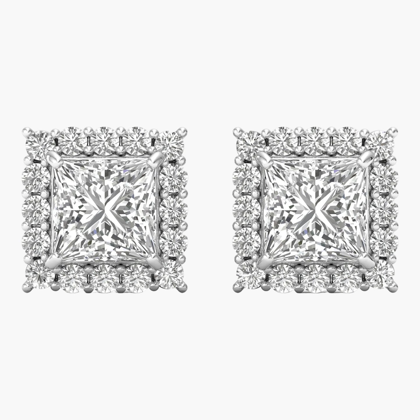 Pair of diamond earrings on a white background