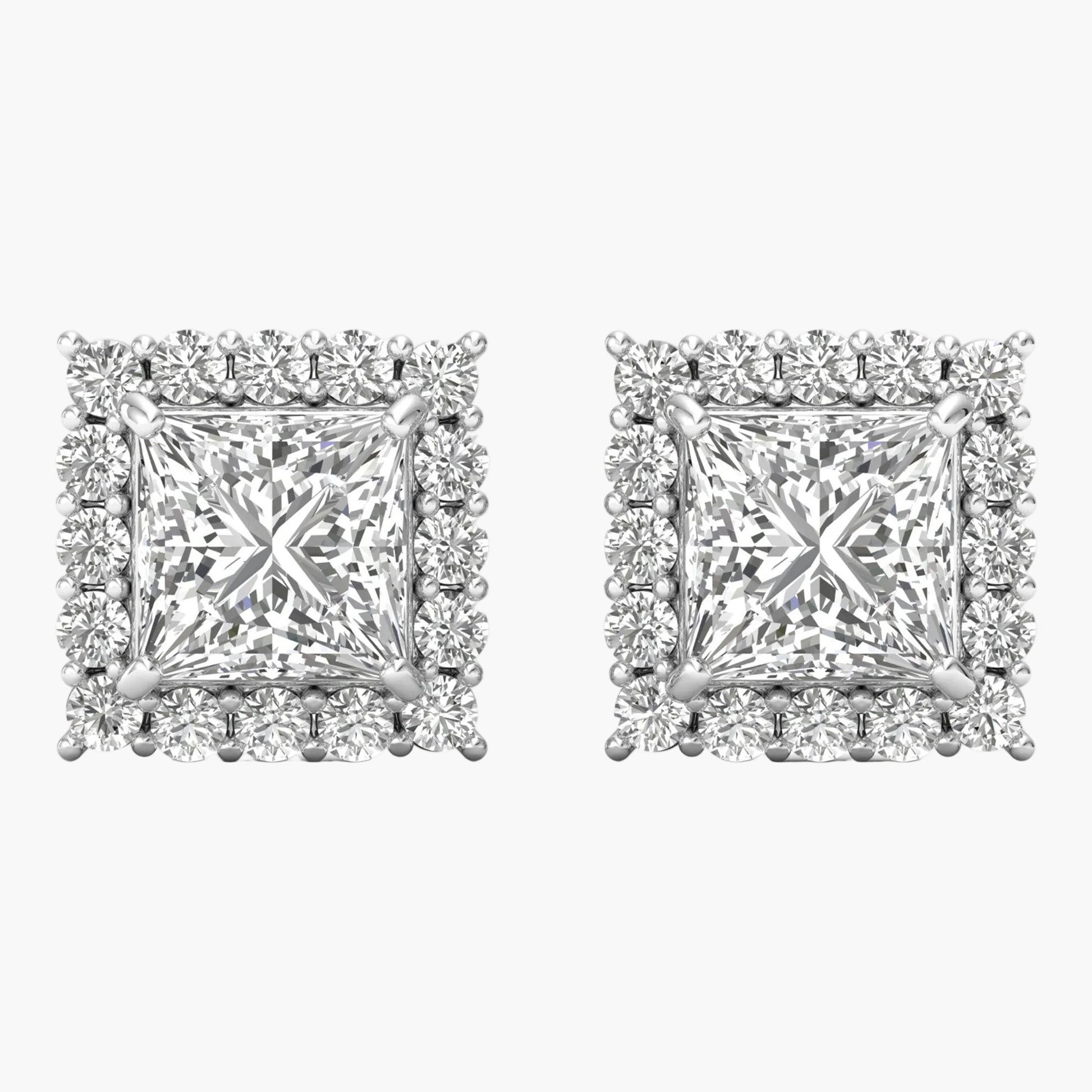 Pair of diamond earrings on a white background