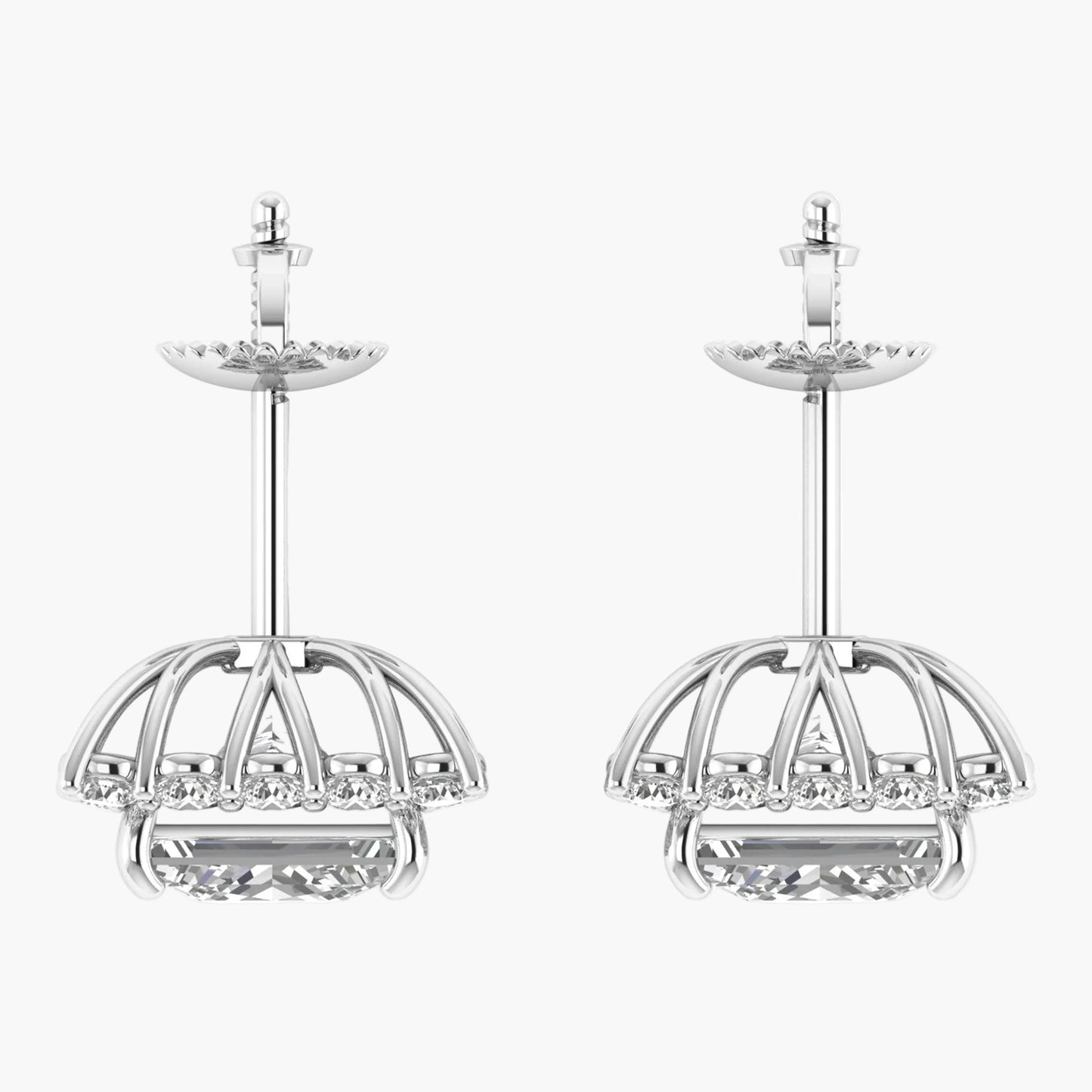 Pair of silver earrings with intricate designs on a white background