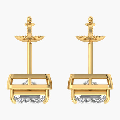 Gold earrings with clear gemstones on a white background