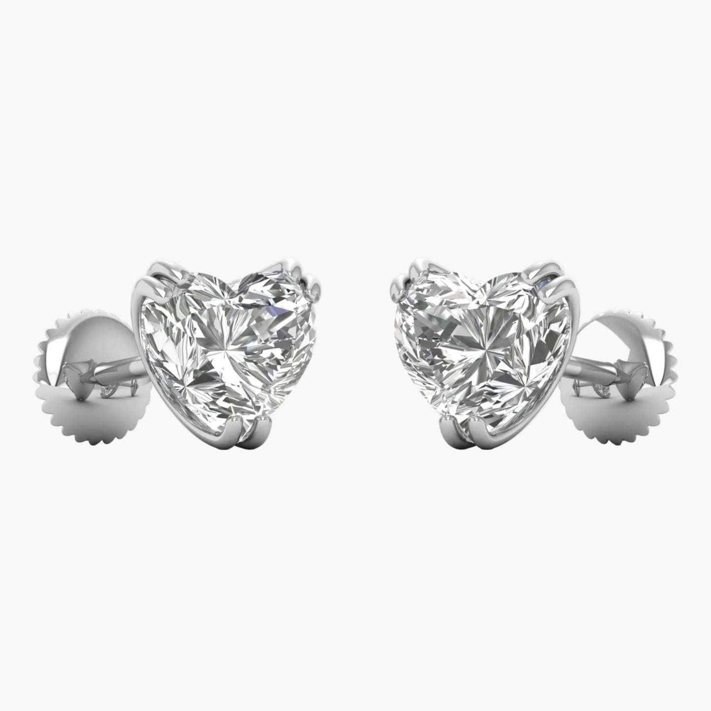 Heart-shaped diamond earrings on a white background