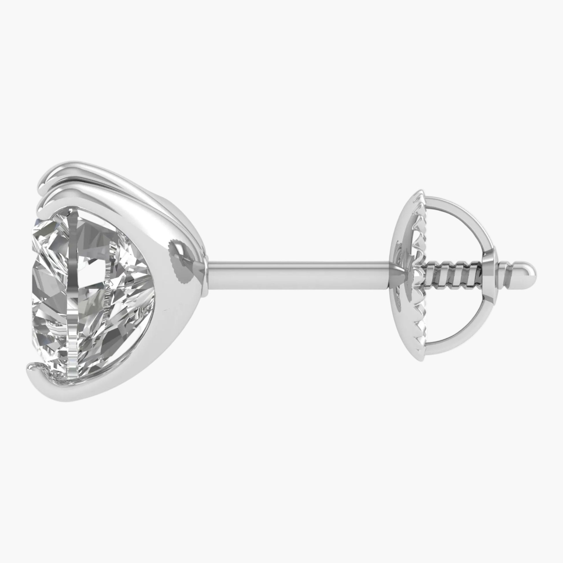Silver earring with a clear gemstone on a white background