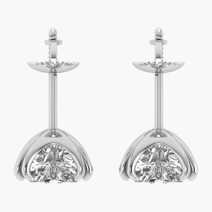 Pair of silver earrings with clear gemstones on a white background